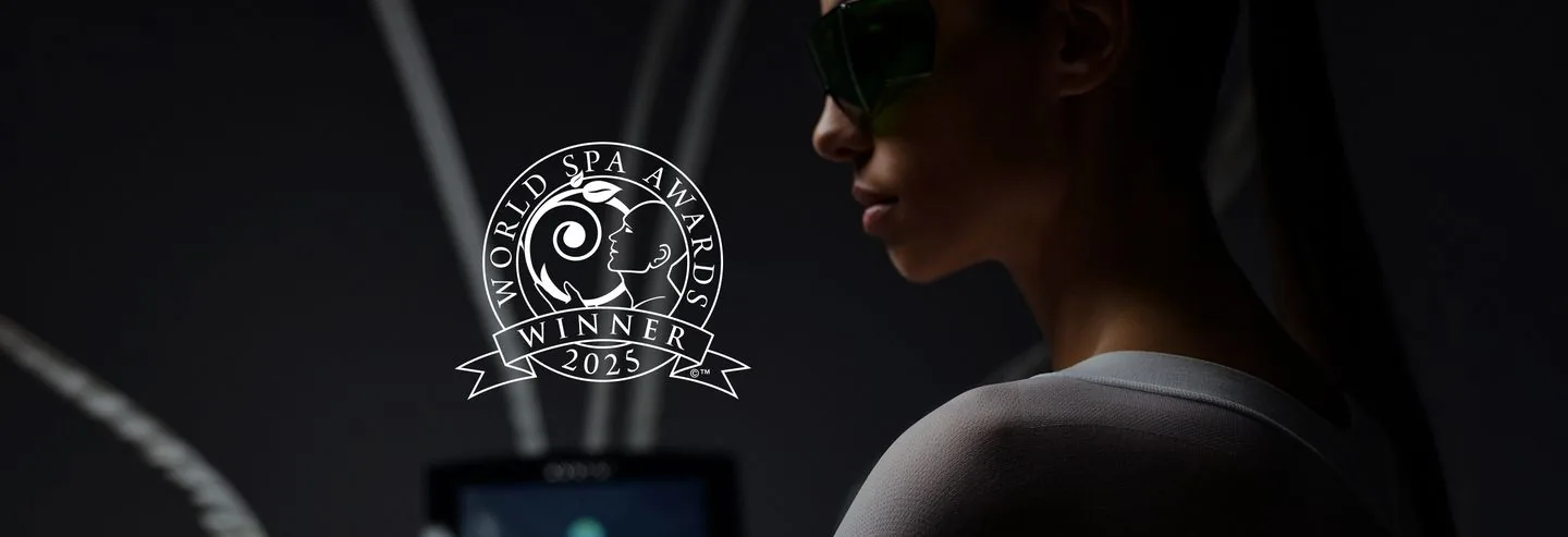 World Spa Awards Winner 2025 emblem on a photo of a guest of SHA Wellness Clinic wearing tinted goggles