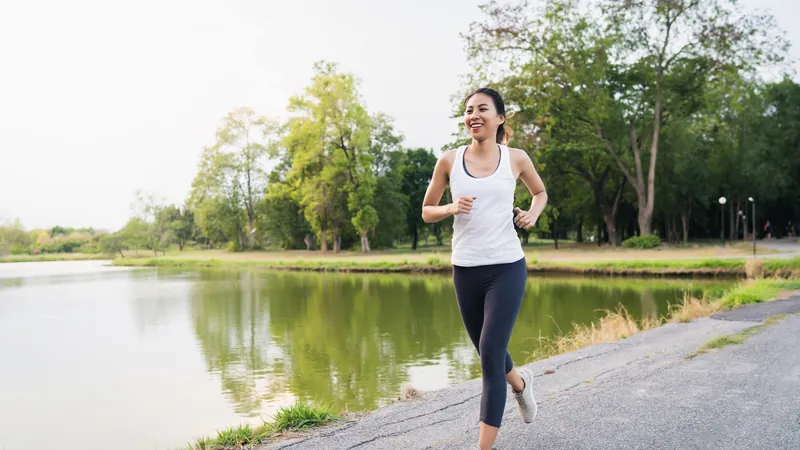 Woman running outdoors in the morning light